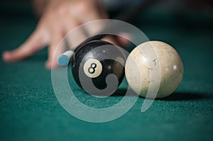 Billiards balls and cue on billiards table. Billiard sport concept