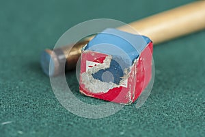 Billiards balls and cue on billiards table. Billiard sport concept. Chalk block on biliard table