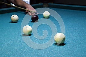 Billiards, billiard table. Targeting the cue in the ball for imp