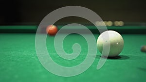 Billiards game, pool table, cue hammers the ball into the hole, snookers game process