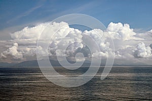 Billowing Clouds On Ocean At Sunset