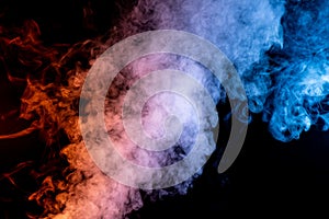 Billowing Plume of Red and Blue Smoke on Top of a Black Background