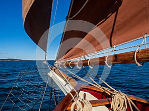 Billowing sails against a blue sky