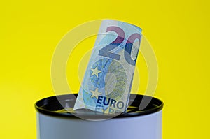 Bills and coins in a piggy bank. Save money. Euro banknotes in a jar.