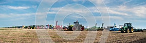 Bilogirya, Khmelnytsky region, UKRAINE - August 19, 2021: tractors with seeder at the demonstration of agricultural machinery,