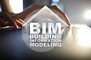 BIM - Building information modeling concept on virtual screen.