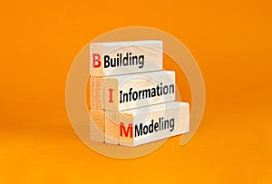 BIM building information modeling symbol. Concept words BIM building information modeling on wooden blocks on beautiful orange