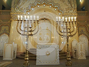 Bima, an elevation usually in the center of the synagogue, where there is a special table for public reading of the