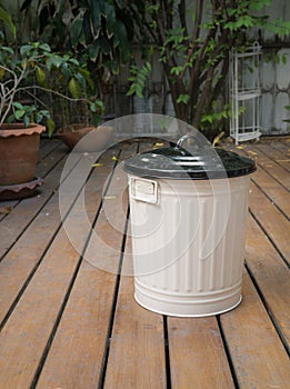 Bin on wooden floor