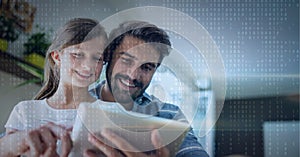 Binar code pattern over father and daughter smiling using tablet
