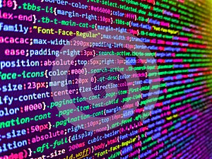 Binary code digital technology background. Program code PHP HTML CSS of site. Close up of random computer code comprised of