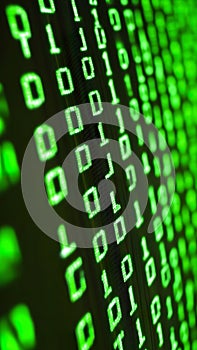 Binary code displayed on screen with green digits and dark background
