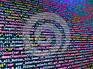 Binary computer code background, abstract. Programmer working in computer screen. Developer working on program codes in office.