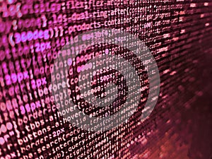 Binary computer code background, abstract. Computer script coding source code on desktop monitor. Background of software developer