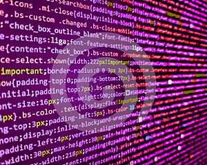Binary computer code background, abstract. Software engineer at work. Screen of web developing php code on dark background.