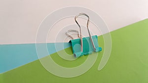 A Binderclip and Colorful Papers