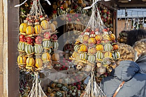 Binding dried citrus fruits at a New Year's street fair, natural flavorings. photo