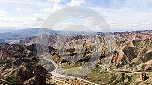 Binggou Danxia Canyon Landform. Road Valley in the Geopark