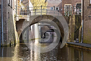 The Binnendieze canal with multiple bridges in the centre of the historical city Den Bosch.