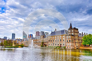 Binnenhof Palace of Parliament inThe Hague in The Netherlands At Daytime. Against Modern Skyscrapers on Background