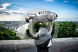 Binocular next to the waterside promenade