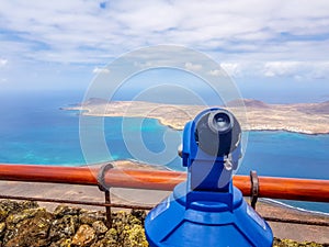 binocular and panoramic view on the volcanic coastline and Isla Graciosa from Mirador del Rio, Lanzarote