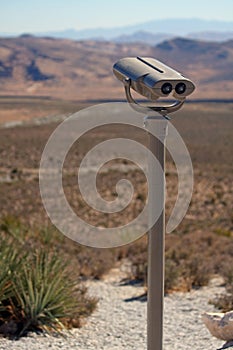 Binocular viewer overlooking desert