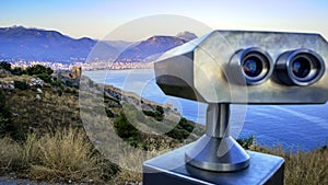 Binoculars on castle looking down to the city