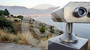 Binoculars on castle looking down to the city