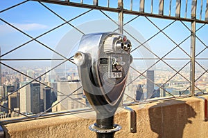 Binoculars on the Empire State Building observation deck in Manhattan