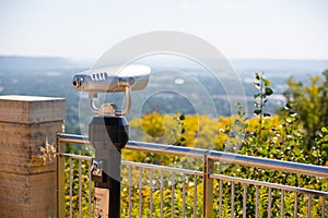Binoculars in front of a railing at Grandad Bluff park overlooking La Crosse