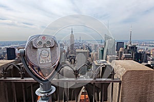 Binoculars looking down to the Empire State building in New York