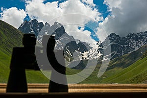 Binoculars lying on sill overlooking mountain.
