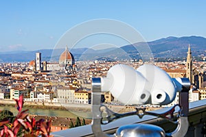 Binoculars on the observation deck in the Piazzale Michelangelo. Florence Italy at sunny day cityscape aerial view