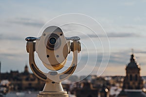 Binoculars on the observation platform in Seville, Spain, during golden hour