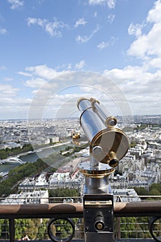 Binoculars overlooking panorama of Paris