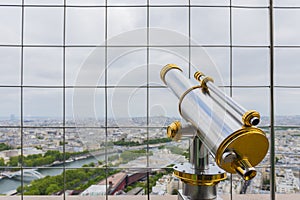 Binoculars overlooking for Paris from top of the EIFFEL TOWER