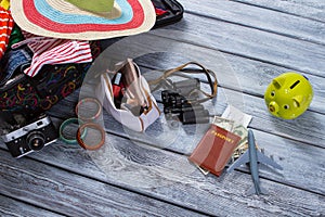 Binoculars and suitcase with clothes.