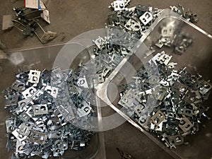 Bins of Metal Peg Backers, Retail Store Fixtures