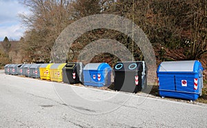 bins for the separate collection of waste in the ecological area for the management of waste materials on the road photo