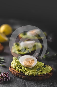 Bio avocado on bread with boiled egg