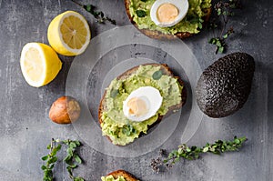 Bio avocado on bread with boiled egg