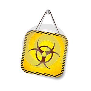 Bio hazard grunge warning sign hanging on the rope on white