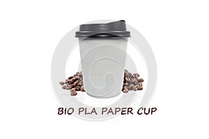 Bio paper cup of coffee to go with coffee beans on white background. photo