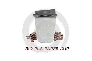 Bio paper cup of coffee to go with coffee beans on white background.