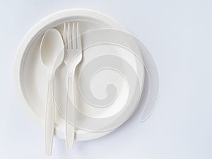 Bio plastic spoons and forks on paper plate