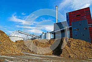 Bio power plant with storage of wooden fuel (biomass) against bl