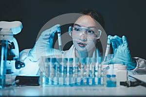 biochemical research scientist working with microscope for coronavirus vaccine development in, Portrait of a Beautiful Female