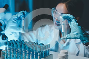 biochemical research scientist working with microscope for coronavirus vaccine development in, Portrait of a Beautiful Female