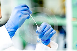 biochemical test in the laboratory. a substance in a glass test tube